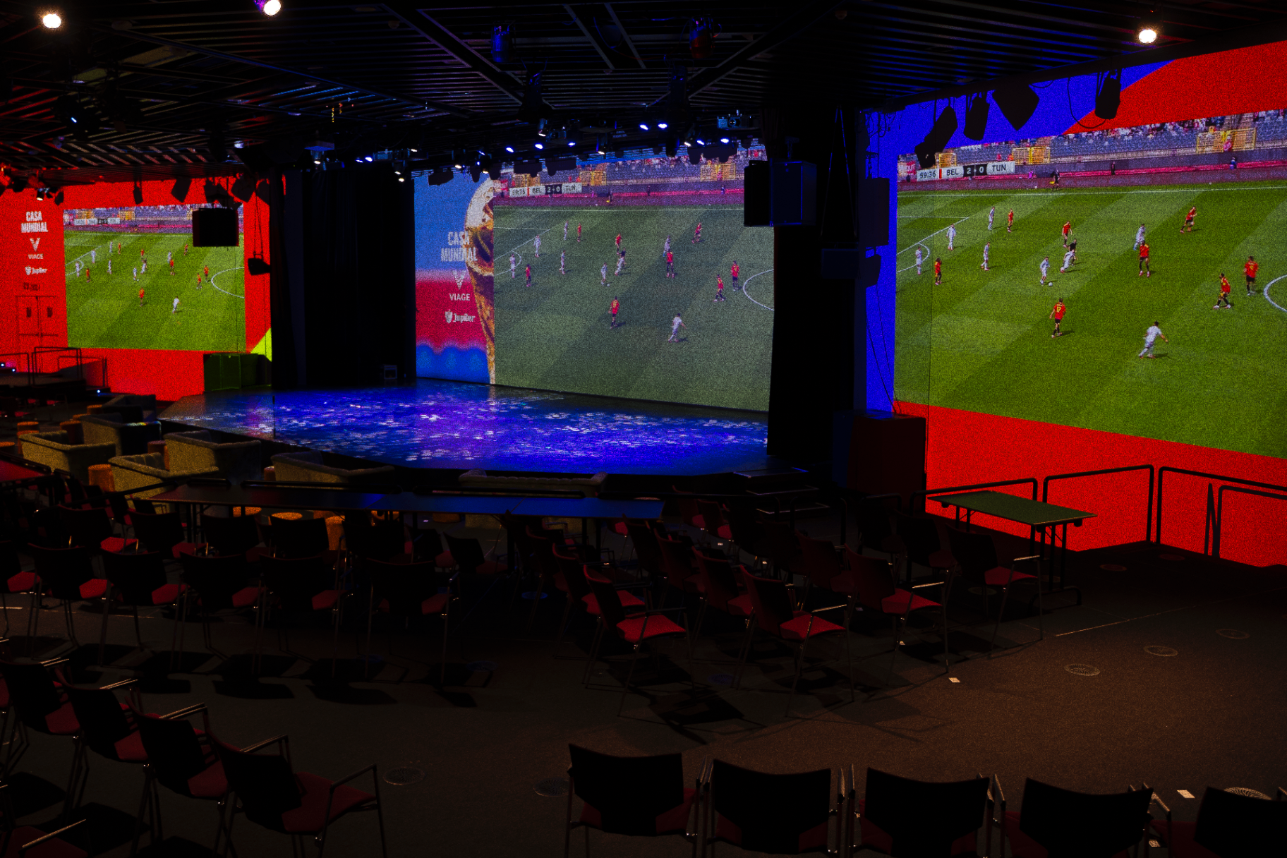 CASA MUNDIAL inside VIAGE with three giant match screens